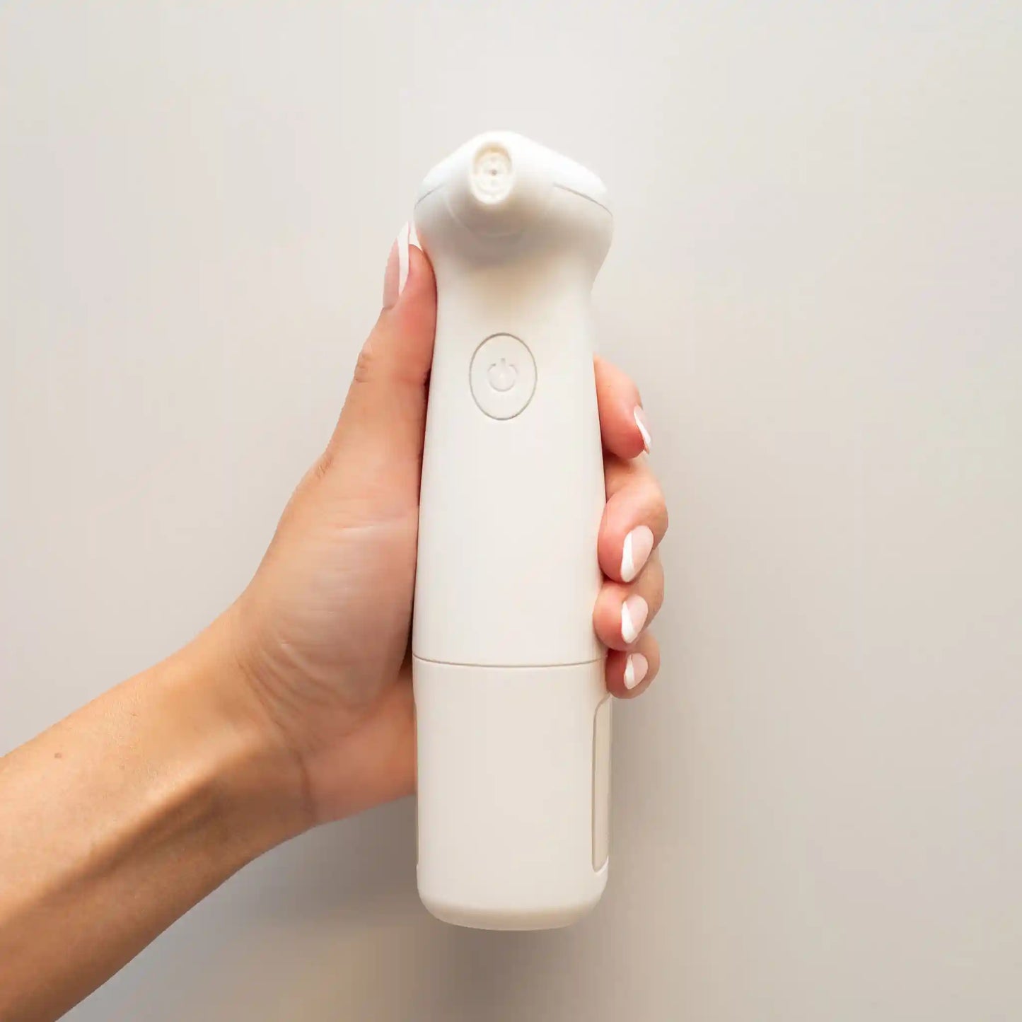 Woman's hand holding the lucky skin hydro device