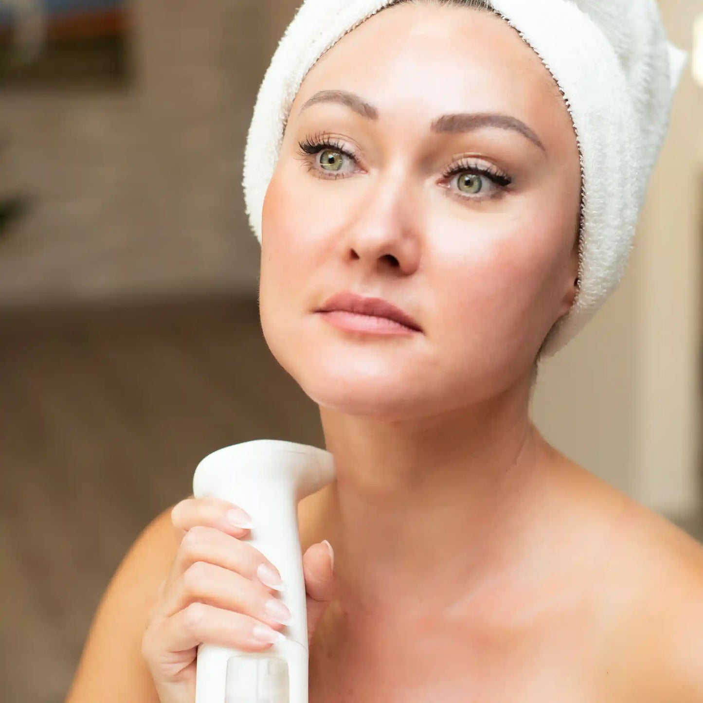 Woman using Lucky Skin Hydro Device on her neck