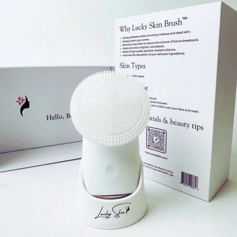 The front view of the Lucky Skin Brush with the boxes it comes in.