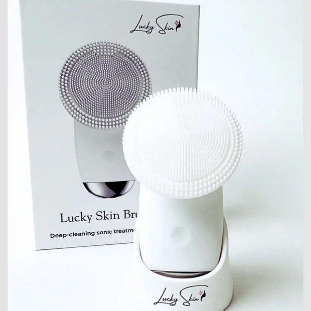 The front view of the Lucky Skin Brush and the box it comes in